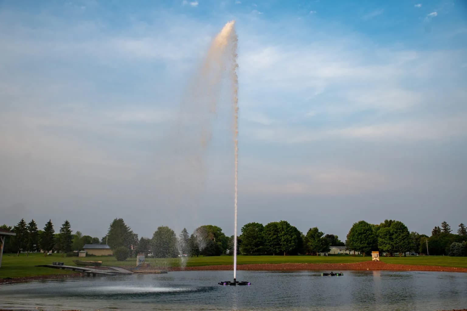 AquaMaster floating fountain spray on a pond